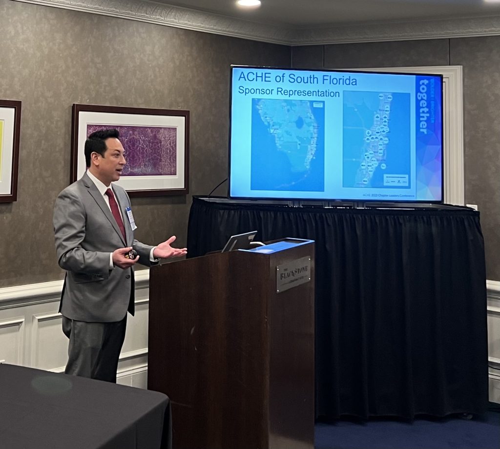 Kenneth C. Wong presenting at the podium at an ACHE Chapter Leaders Conference session
